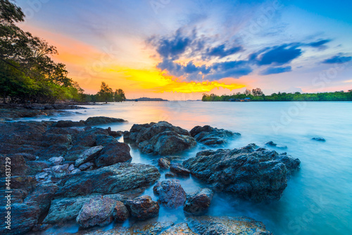 Amazing sunset in Dangas beach, Batam island, stone on beach