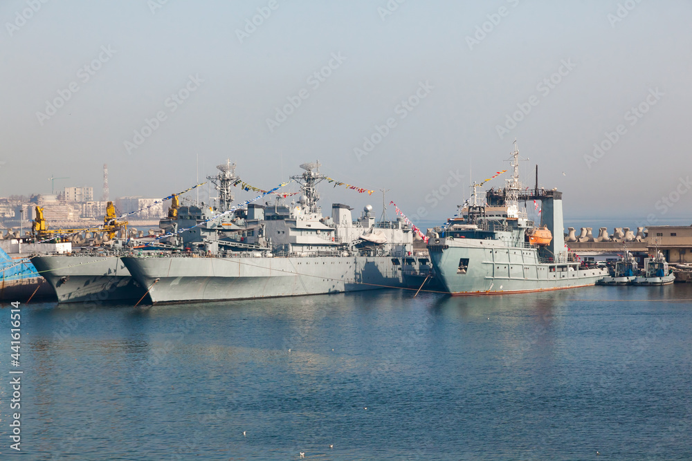 Ships of the Romanian Navy are moored at the pier in the port of Constanta. Warships at the pier.