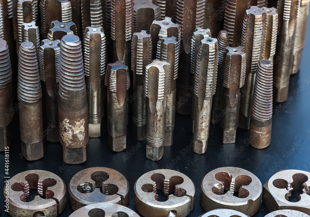 Taps and dies for metal threading. Tools for cutting external and