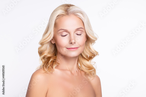 Portrait of attractive dreamy woman clear pure skin cosmetic tone correction isolated over white color background