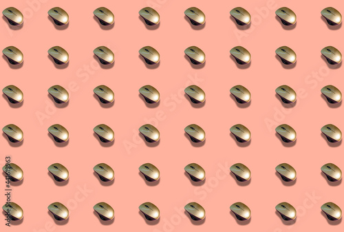 A pattern with a wireless computer mouse on a pink background.