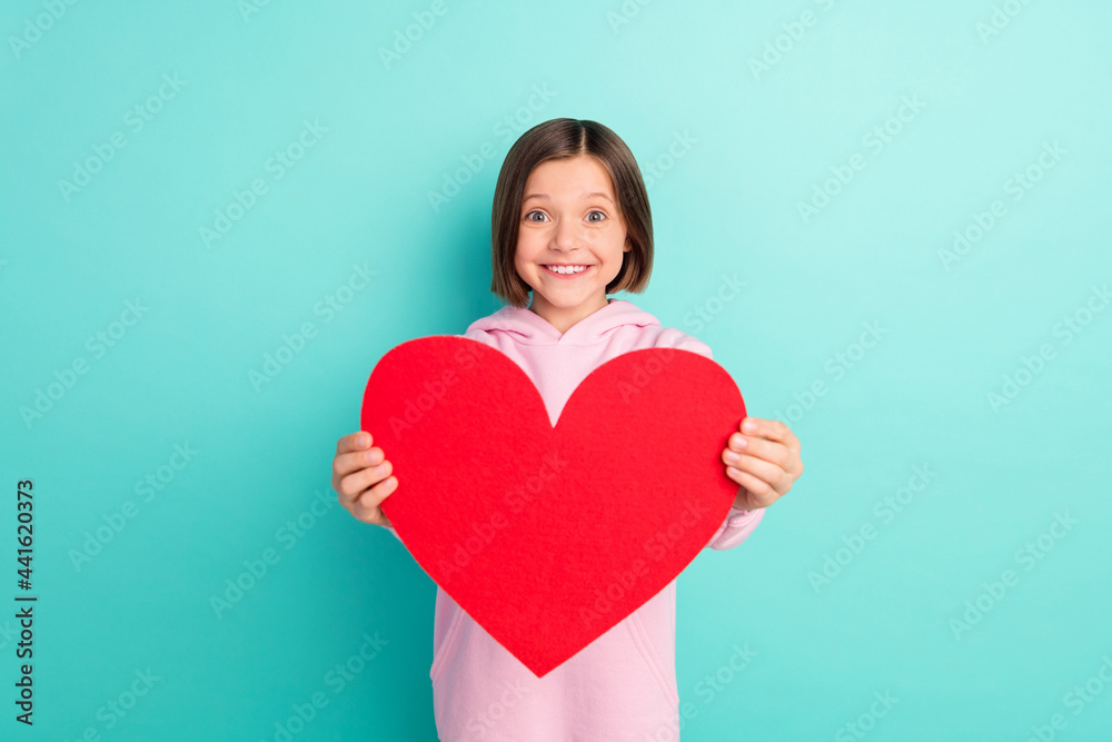 Photo of brunette hairdo lovely little girl give paper heart wear pink sportswear isolated on teal color background Photo of brunette hairdo lovely little girl give paper heart wear pink sportswear isolated on teal color background