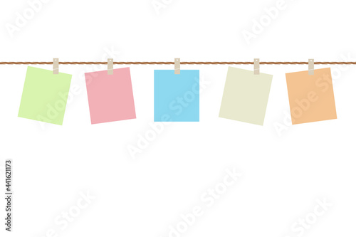 Blank papers colorful hanging on rope isolated on white background with copy space