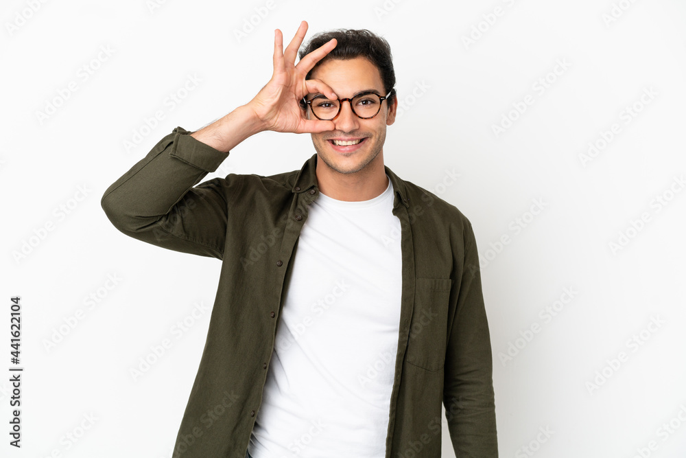 Caucasian handsome man over isolated white background showing ok sign with fingers Caucasian handsome man over isolated white background showing ok sign with fingers