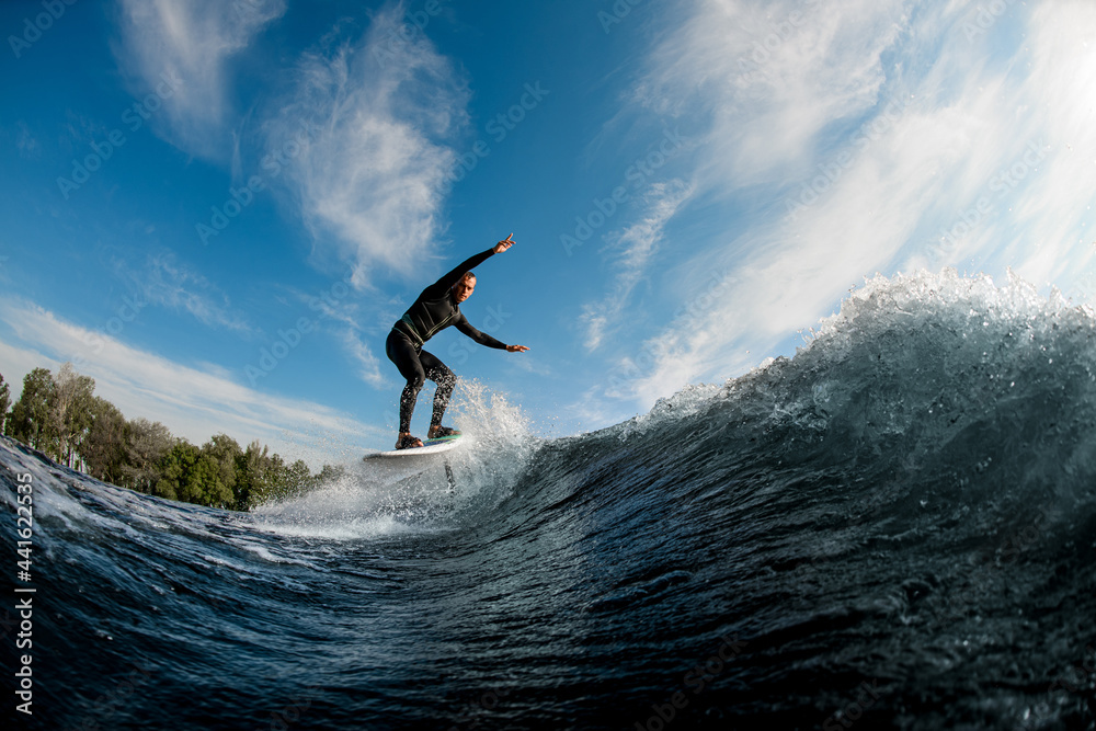 active man running on the wave with hydrofoil foil board active man running on the wave with hydrofoil foil board