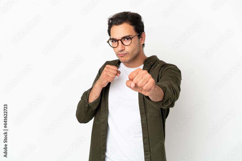 Caucasian handsome man over isolated white background with fighting gesture Caucasian handsome man over isolated white background with fighting gesture