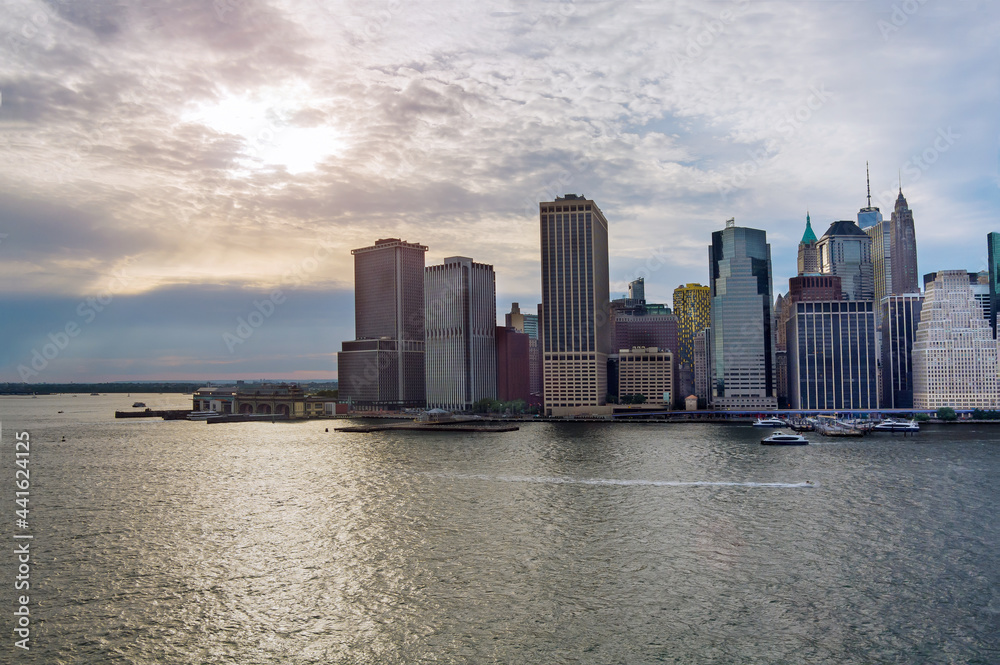 Fototapeta premium Lower Manhattan urban skyscrapers with water taxi boat Whitehall South Ferry Terminal, New York way from Staten Island NY NJ