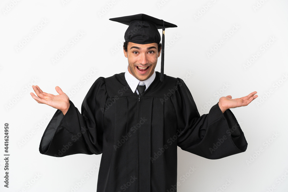 Young university graduate over isolated white background with shocked facial expression