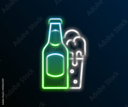 Glowing neon line Beer bottle and glass icon isolated on black background. Alcohol Drink symbol. Colorful outline concept. Vector