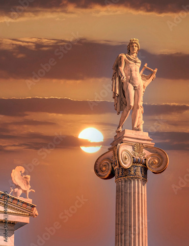 Apollo the ancient god of arts and sun on impressive sky, Athens Greece photo