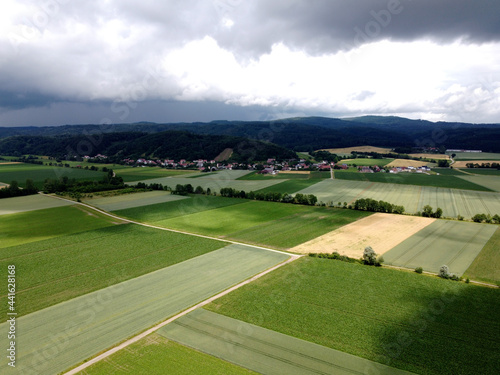 green field and clouds