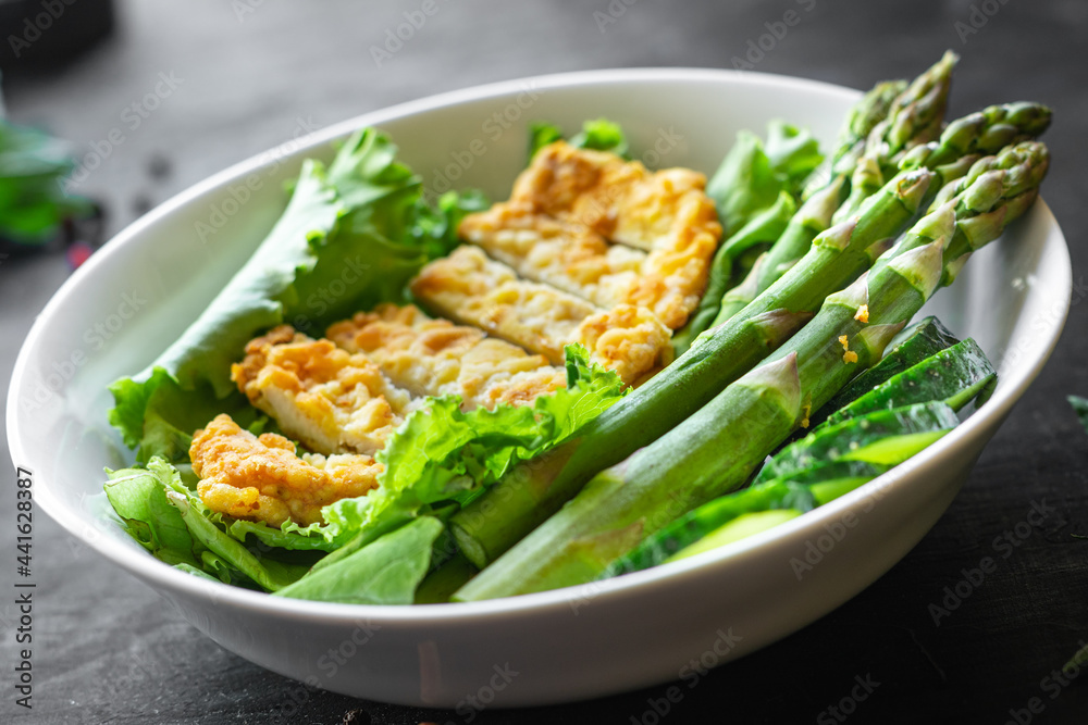 salad bowl chicken meat, asparagus, greens salad leaves vitamin eating organic diet on the table healthy food meal snack copy space food background rustic. top view keto or paleo diet veggie salad bowl chicken meat, asparagus, greens salad leaves vitamin eating organic diet on the table healthy food meal snack copy space food background rustic. top view keto or paleo diet veggie