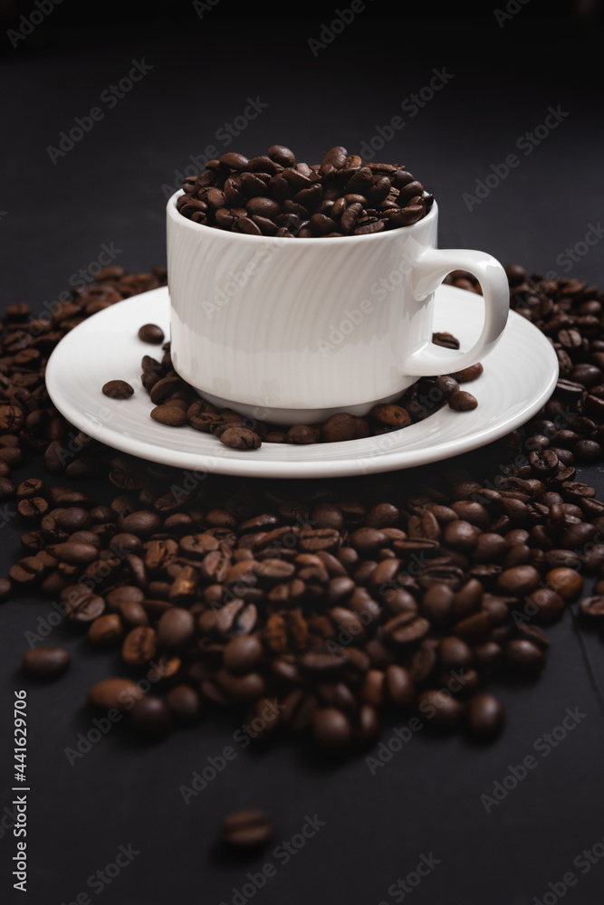 Cup of coffee isolated on coffee background Cup of coffee isolated on coffee background