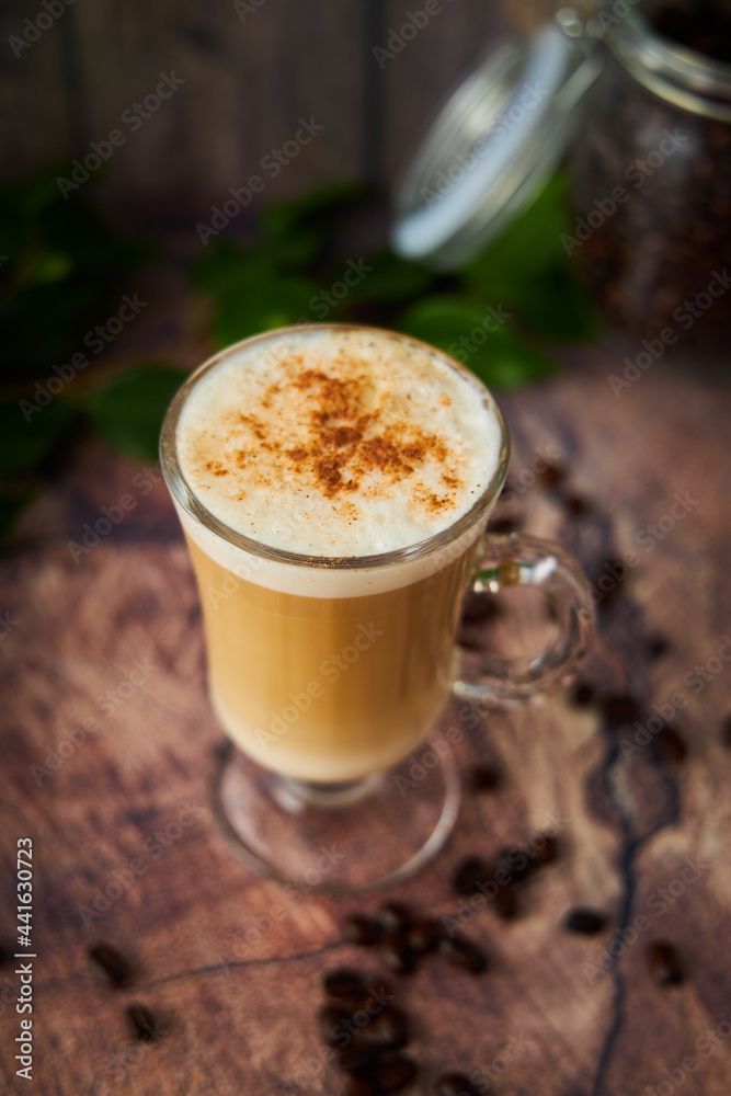 cup of cappuccino coffee with foam on rustic background cup of cappuccino coffee with foam on rustic background