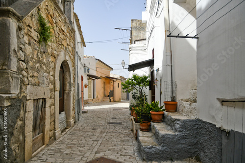 Candela, Italy, 06/21/2021. A small street between the old houses of a mediterranean village of Puglia region. © Giambattista