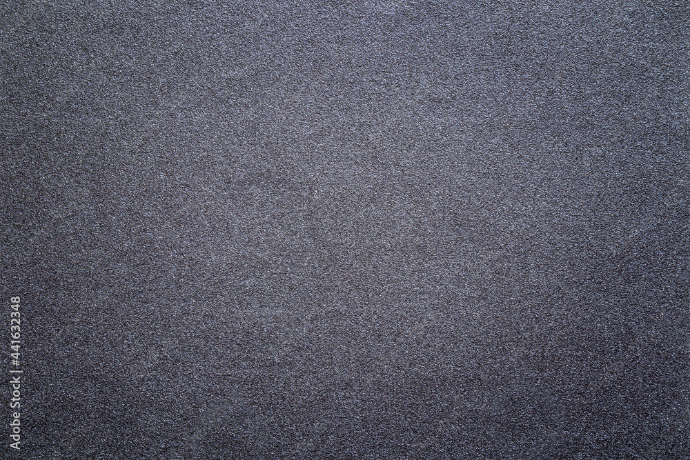 Sandpaper texture background gives a beautiful pattern of black sand grains on sandpaper, suitable as a background for inserting text. Copy Space for designers to use on sandpaper. Sandpaper texture background gives a beautiful pattern of black sand grains on sandpaper, suitable as a background for inserting text. Copy Space for designers to use on sandpaper.
