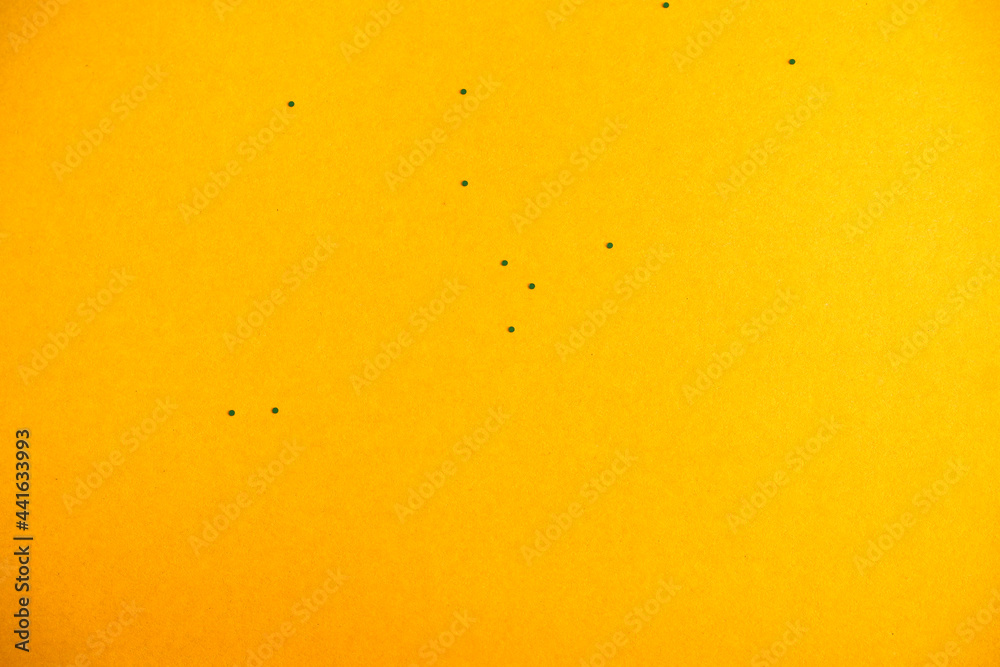 Yellow background. Cardboard texture with sparkles.