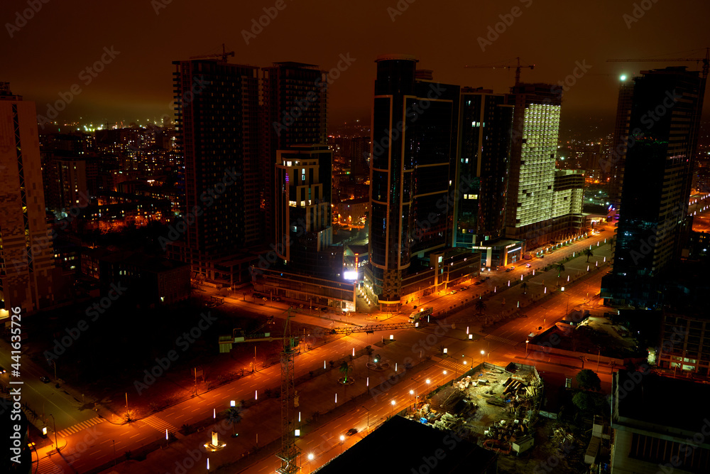Night cityscape of Batumi. Modern architecture in the city lights