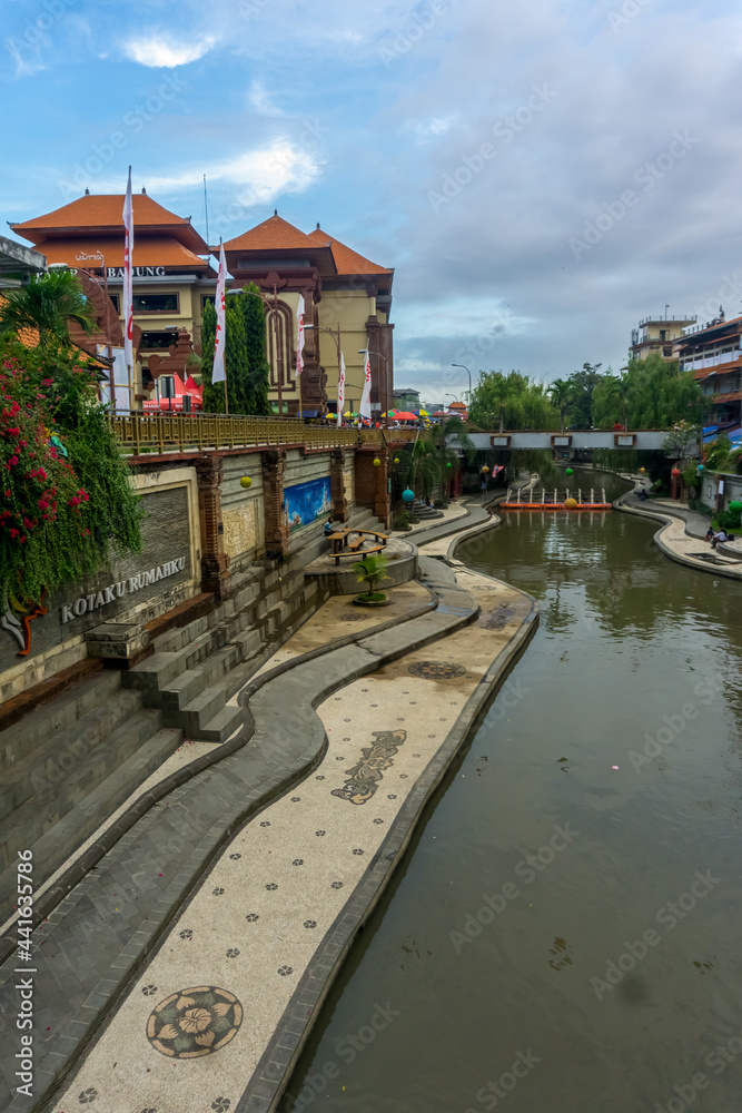 Fototapeta premium Denpasar, Bali, Indonesia (June 19, 2021): Peaceful and cool atmosphere on the river side in the middle of Denpasar city. Called the river 