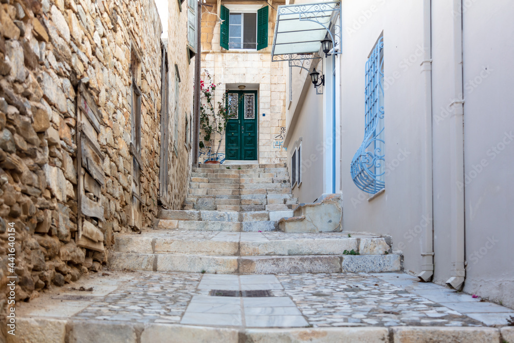Stone stairs drives to aged house at capital of Syros island, Hermoupolis, Cyclades, Greece.