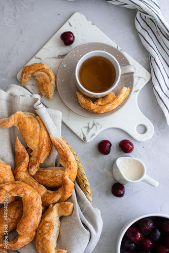 breakfast tea with pastries on white background