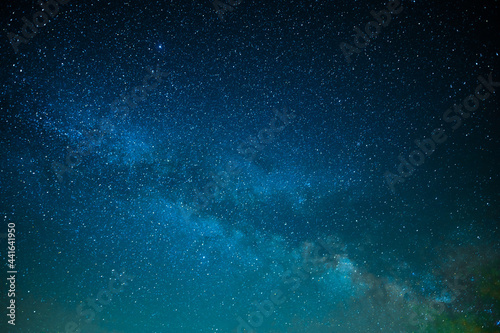 Milky Way. Starry night sky. Beautiful landscape. The majesty of nature. Starry silence and silence. Various shades of blue. Small stars twinkle in the night sky.