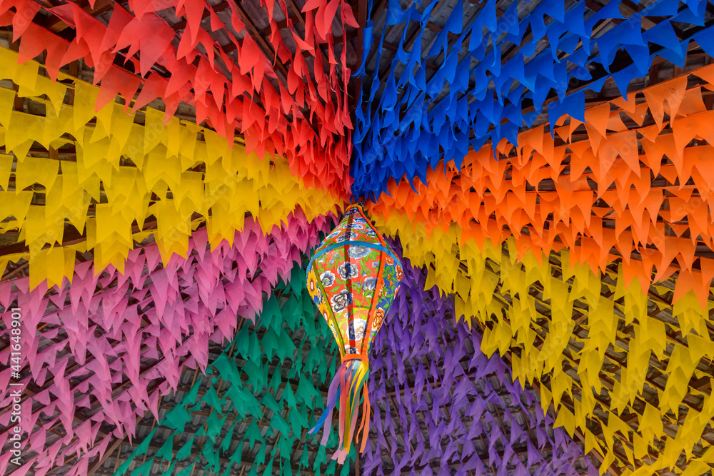 Colorful flags and decorative balloon for the Saint John party, which takes place in June in northeastern Brazil. - obrazy, fototapety, plakaty 