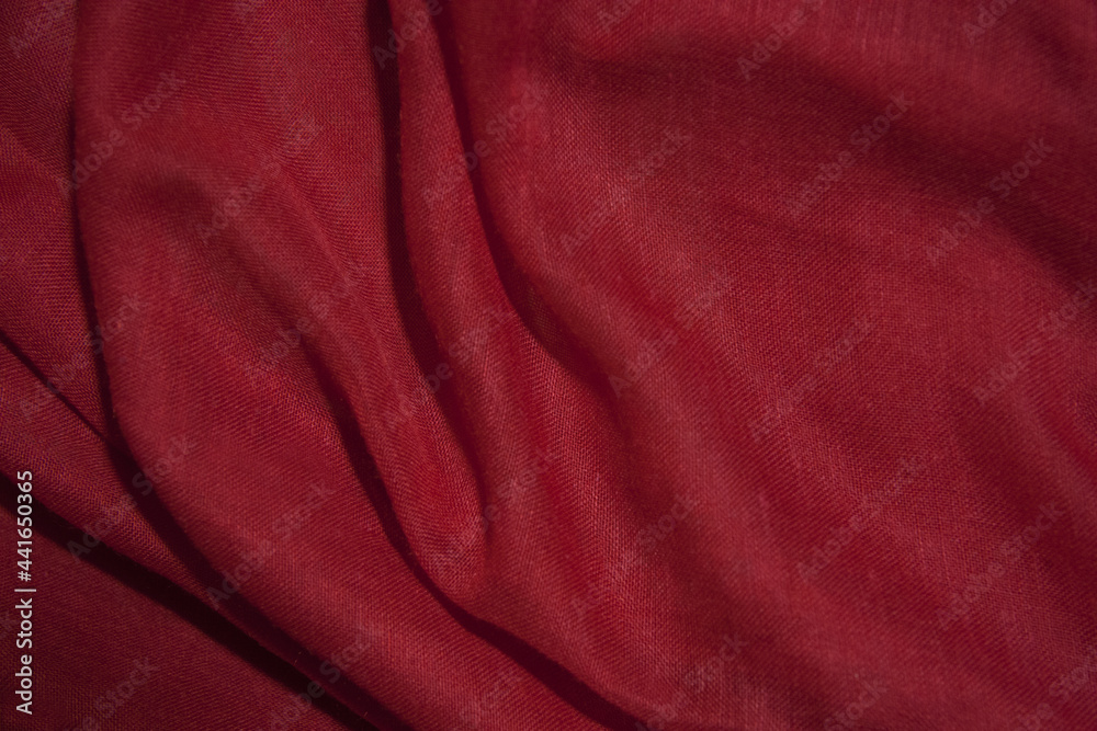 Obraz premium Red cotton fabric, soft and wavy.
