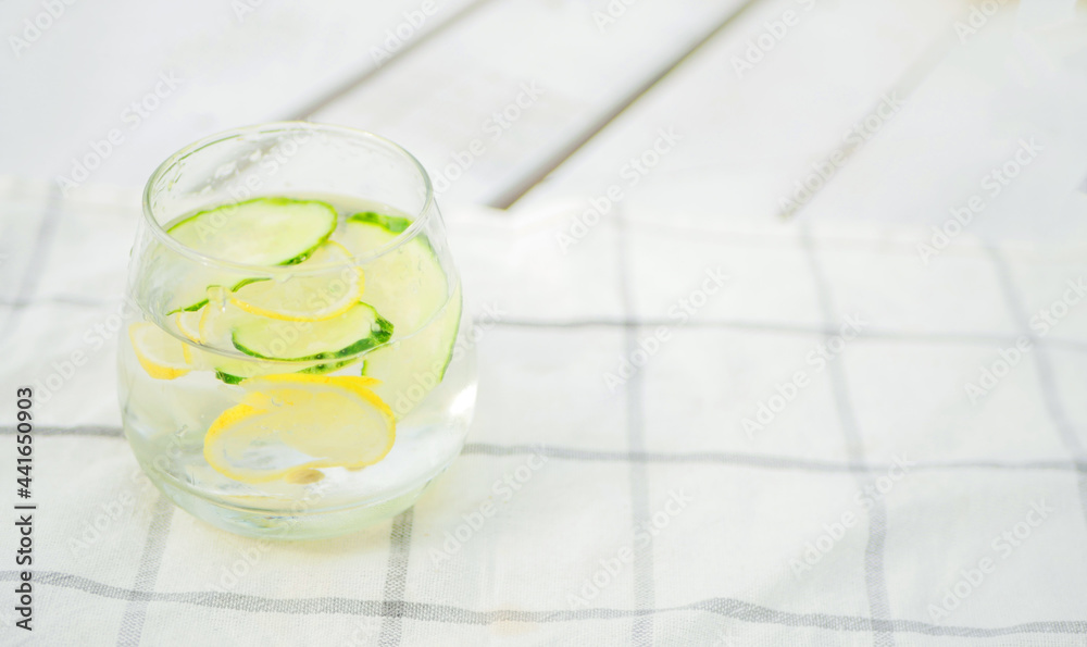 Refreshing summer drink with lemon and cucumber. Water balance in body. Copy space. Refreshing summer drink with lemon and cucumber. Water balance in body. Copy space.