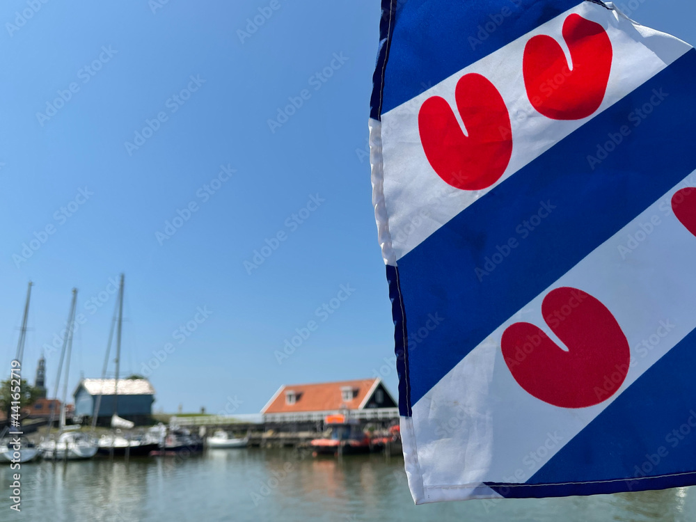 Frisian flag at the harbor of the city Hindeloopen