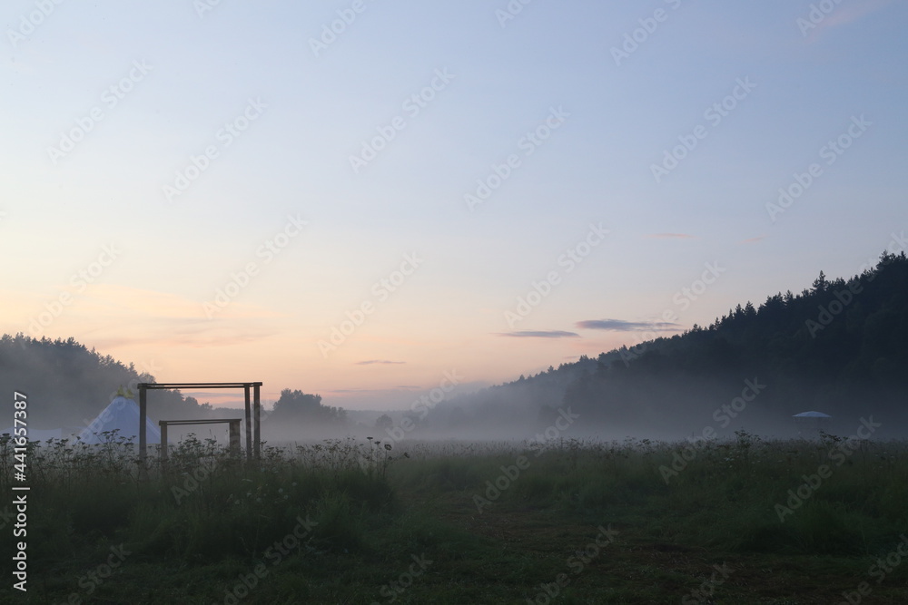 fog in the field at dawn at the open air festival
forest and feeld