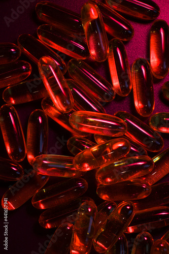  capsules under red  lighting photo