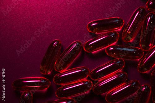  capsules under red  lighting