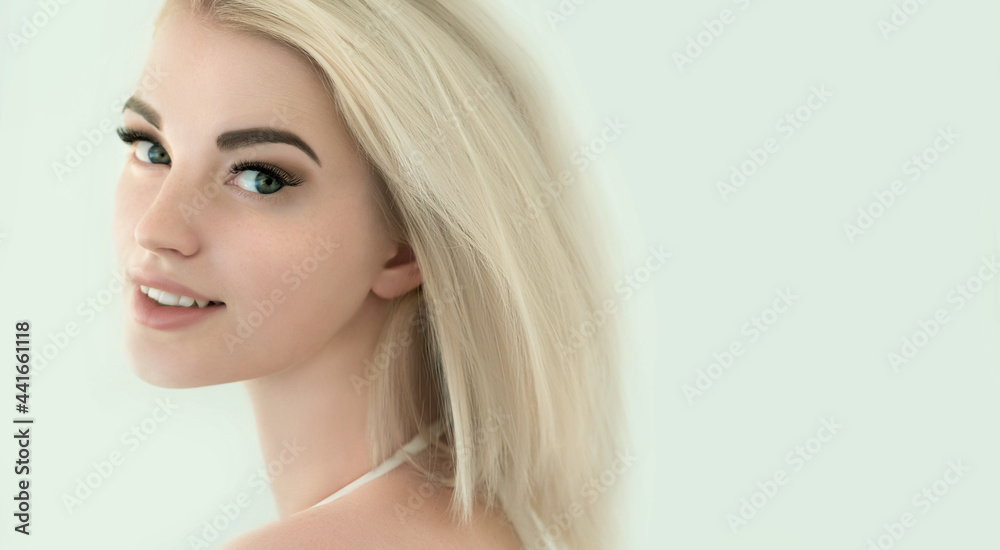 Beauty smiling blonde model with natural nude make up and long eyelashes. Skin care, Spa and wellness concept. Make up, long hair and lashes. Close up, selective focus Beauty smiling blonde model with natural nude make up and long eyelashes. Skin care, Spa and wellness concept. Make up, long hair and lashes. Close up, selective focus