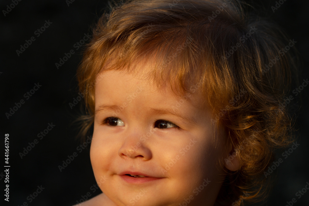 Caucasian baby child portrait close up. Kids face on sunny day. Caucasian baby child portrait close up. Kids face on sunny day.