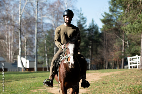 Young Man Riding a Horse