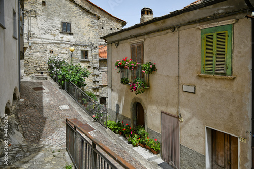 Fototapeta Naklejka Na Ścianę i Meble -  A small street between the old houses of Poggio del Sannio, a medieval village in the Molise region.