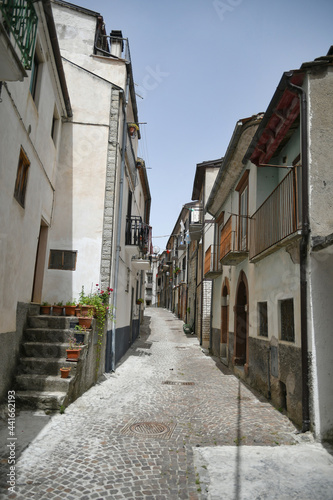 Fototapeta Naklejka Na Ścianę i Meble -  A small street between the old houses of Poggio del Sannio, a medieval village in the Molise region.