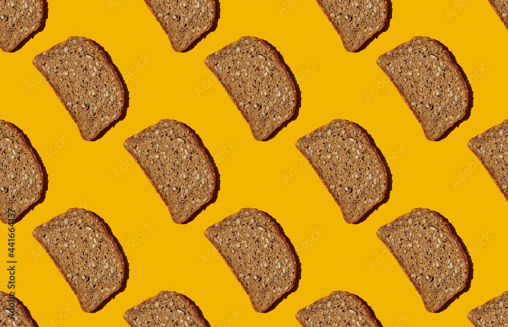 Pattern of bread slices on yellow pastel  background