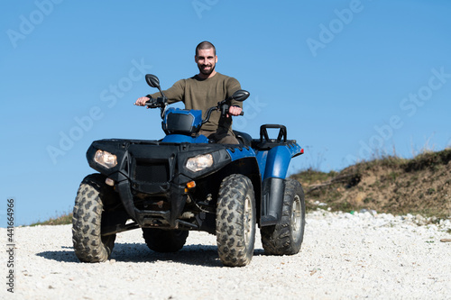 Man Driving Off-road With Quad Bike or Atv