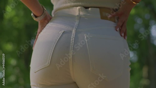 Beautiful female ass in white jeans.Red Helium 8K photo