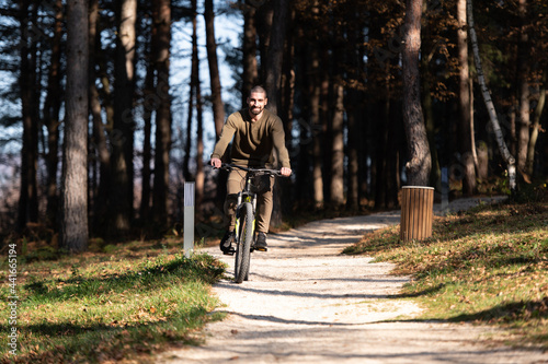 Portrait of Active Man Riding on Bike © Jale Ibrak