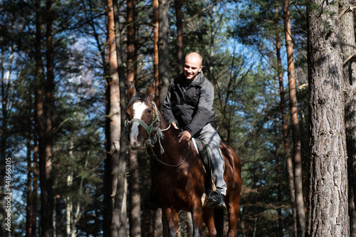 Young Man Riding a Horse