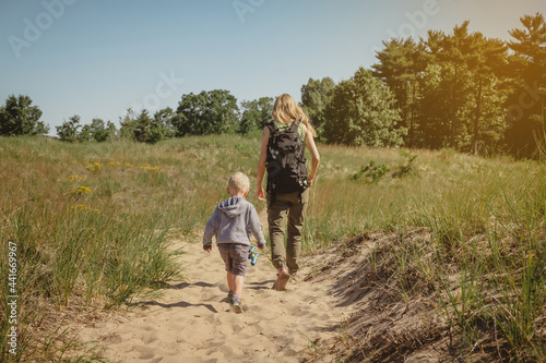 Mother and young son walking along a path at Indiana Dunes State Park