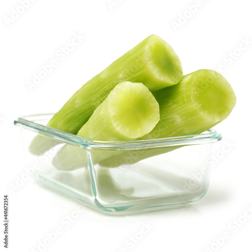 Asparagus lettuce on white background  photo