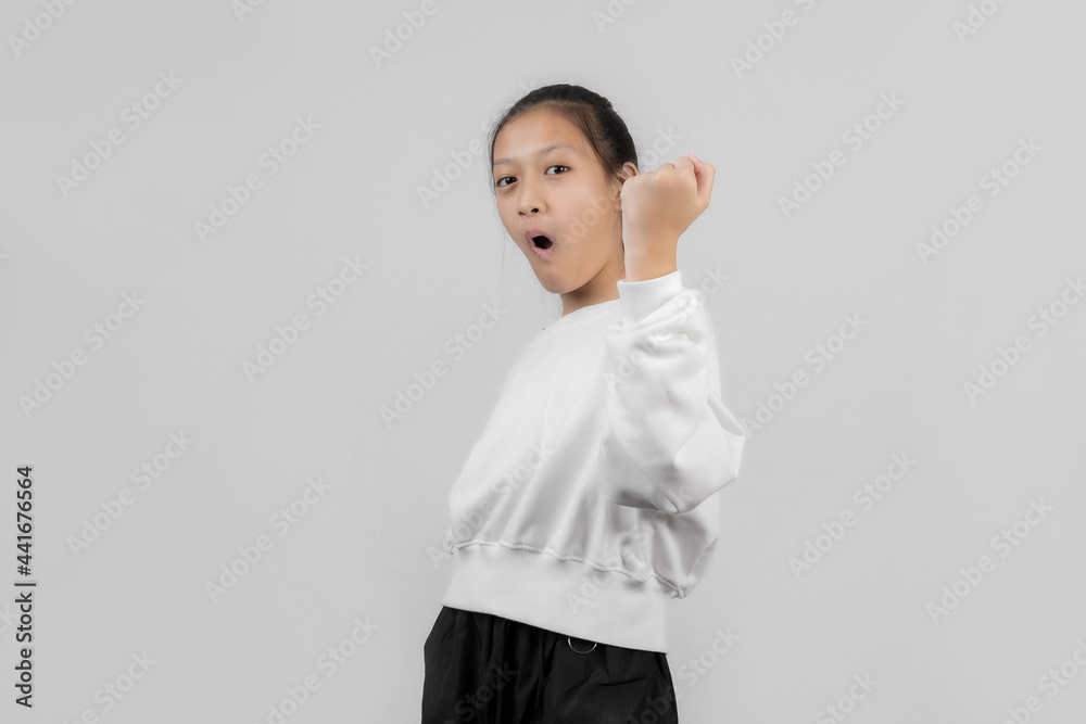Asian little girl studio portrait on gray background Asian little girl studio portrait on gray background