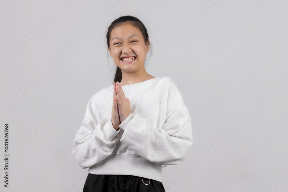 Asian little girl studio portrait on gray background Asian little girl studio portrait on gray background