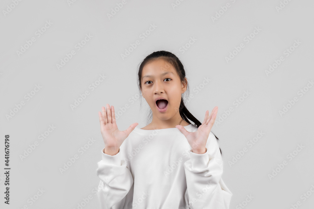 Asian little girl studio portrait on gray background Asian little girl studio portrait on gray background