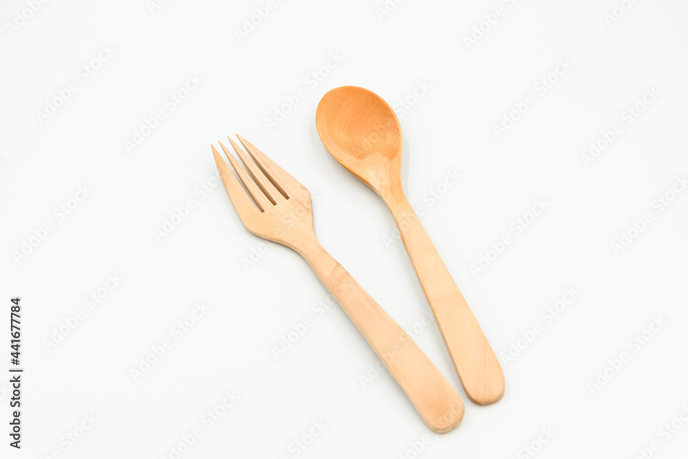 Isolated wooden spoon and fork as household in the kitchen Isolated wooden spoon and fork as household in the kitchen