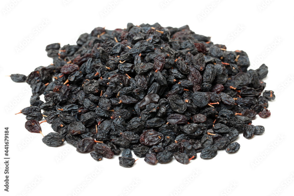 black raisins on a white background black raisins on a white background